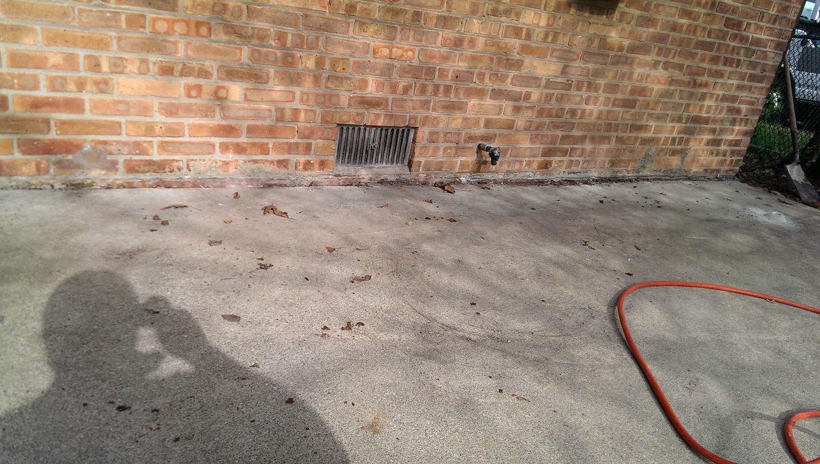 A patio slab with the grout hose run out