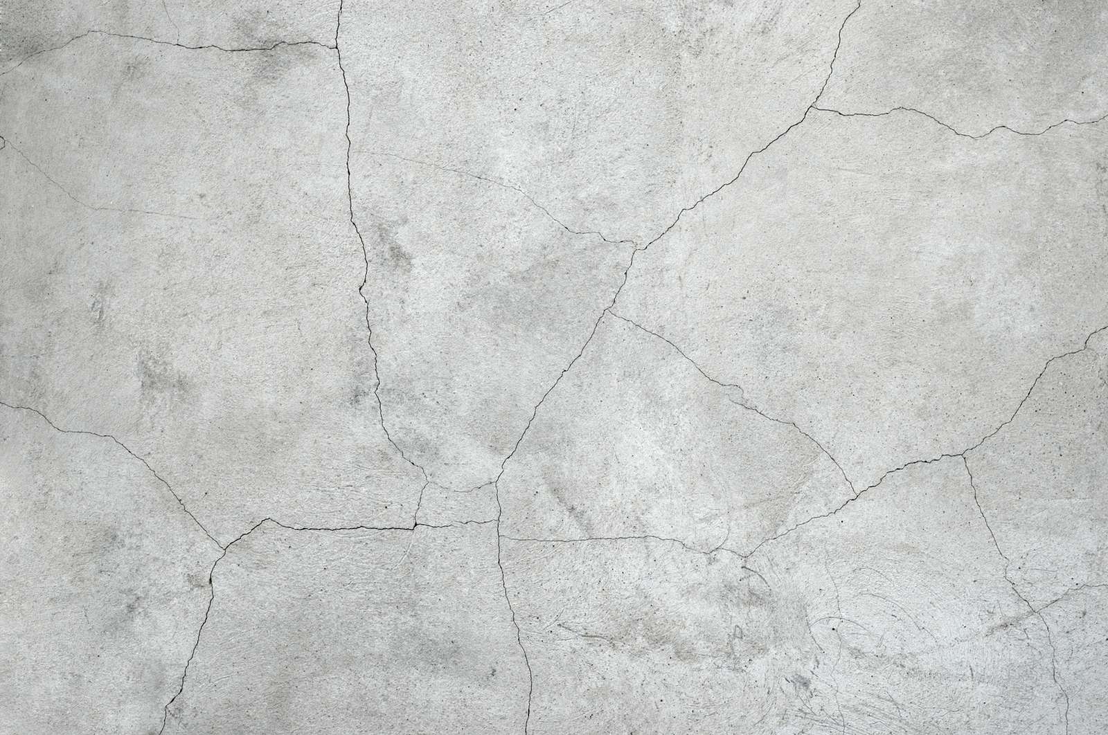 A sunken and cracked concrete slab