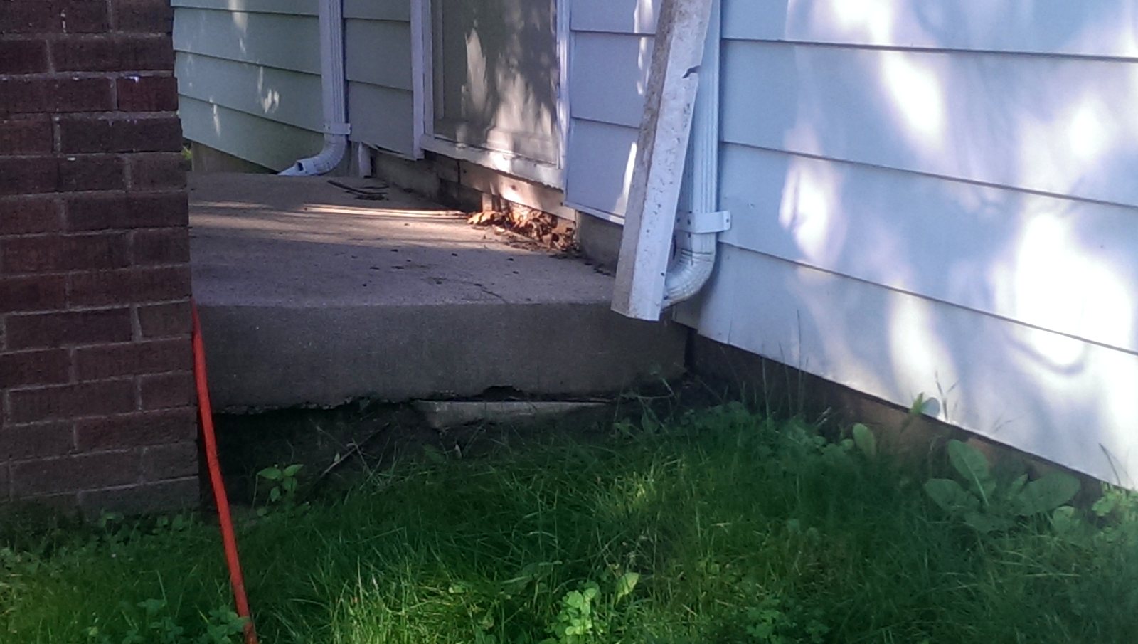 A settled slab pulled away from the house